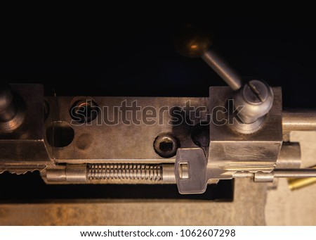Close view of key copying machine with keys in locksmith workshop