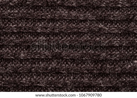 maroon and gray colored knit fabric texture.