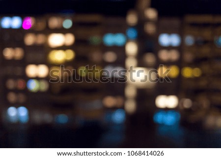 Beautiful abstract blurred night city scene with residential buildings as subject