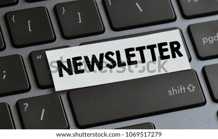 Closeup of laptop keyboard buttons with symbols and text newsletter