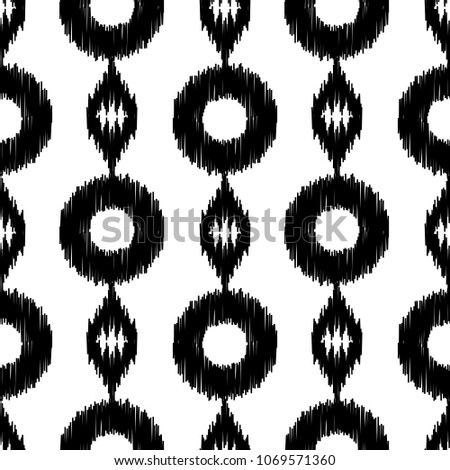 Ethnic black and white seamless pattern. Boho abstract geometric repeat textile print isolated on white background. Folk fashion strip hand made effect wallpaper.