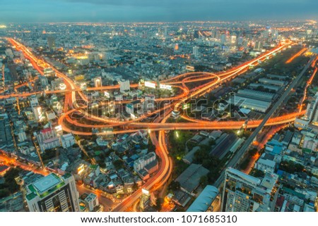 Bangkok skyline with express way during sunset, view from high burilding roof top, Thailand
