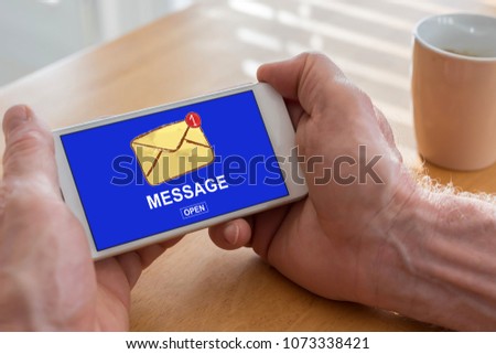Male hands holding a smartphone with message concept