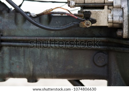 The access point of the starter motor of diesel engine.