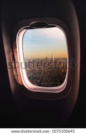 aerial view of Manhatten, New York City, seen through an airplane window