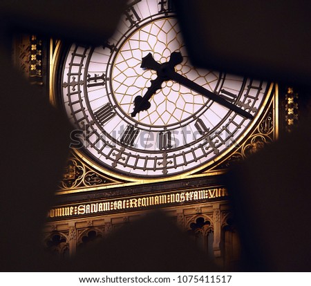 Unique view of the Big Ben clock face through a star-shaped hole (London, United Kingdom). Translation: 