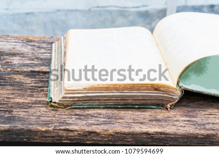old book on a wooden table