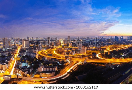 Bangkok city with light trail on express road at sunset. Beautiful cityscape at dusk.