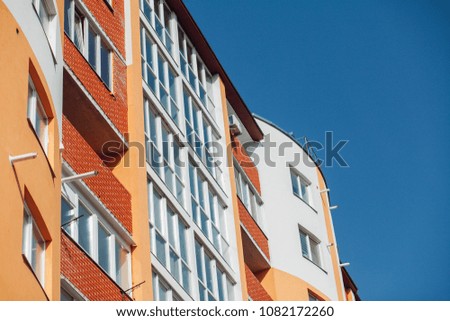 Modern apartment buildings on a sunny day with a blue sky. Facade of a modern apartment building
