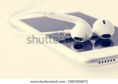 Personal gadget for listening to music through headphones. Photo close up with shallow depth of field.