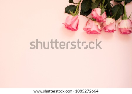 Stunning pink bouquet of roses on punchy pink background. Copy space, floral frame. Wedding, gift card, valentine's day or mothers day background