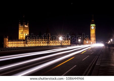 big ben and house of parliament seen through the traffic lights