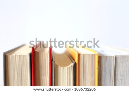 Close-up of multi-color  books line selective focus and shallow depth of field