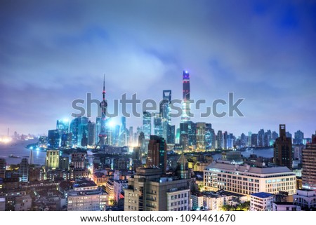 panorama of skyscrapers with overlooking perspective  in a modern city at night