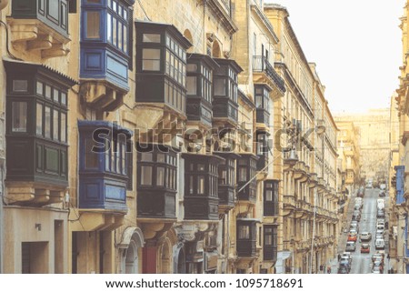 Malta, Valletta, traditional house building facade with sandstones and covered balconies	
