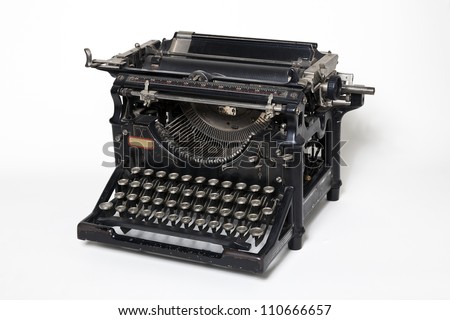 Old antique typewriter on a white background