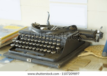 vintage typewriter and books on the table           