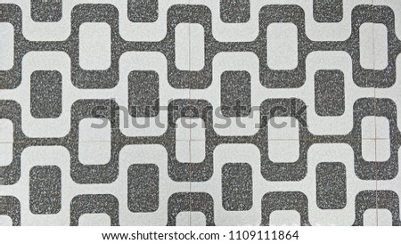 The patterned floor tiles
