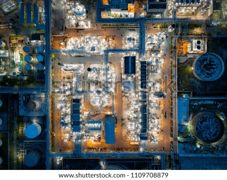 Top view of oil refinery at night. Aerial view of refinery plant at sunset. refinery factory and tank