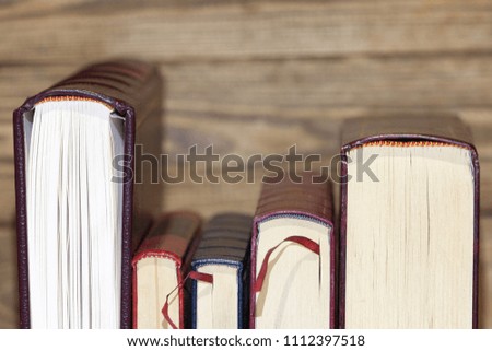 Old books on wood background