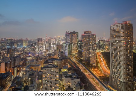 Night view of Tokyo city with high building and expressway