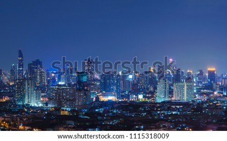 Smart city. Financial district and skyscraper buildings. Bangkok downtown area at night, Thailand.