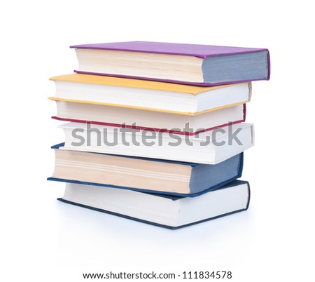 Stack of old antique books isolated on white background