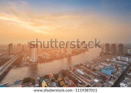 After sunset over Bangkok city river curved, Thailand central business downtown