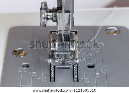 Macro Close Up Of Tailor Threading Sewing Machine