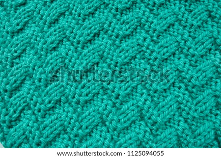 Green thread for knitting. Openwork knitting.
