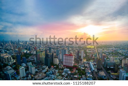Beautiful Bangkok city, bird eye view on modern new buildings or skyscrapers cityscape on daytime and night time, panoramic scene showing urban skyline and business office towers