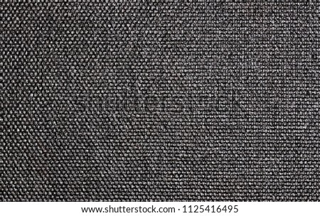 Black shiny textile texture macro.