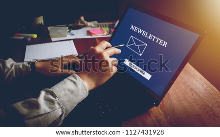 newsletter concept Hand of businessman checking message box on digital laptop Vintage tone filter