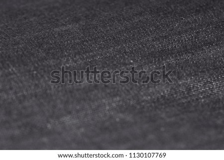 Grey denim Fabric with stitches, Macro photography. denim fabric wallpaper.