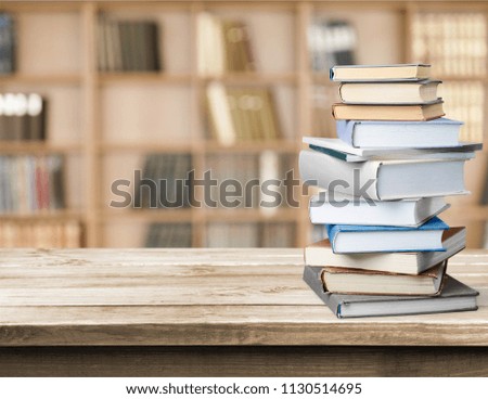 Book stack on wood desk