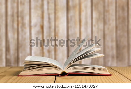 Open book on wood table
