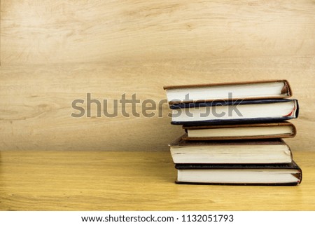 Books and notepads on a table. School knowledge and education concept.