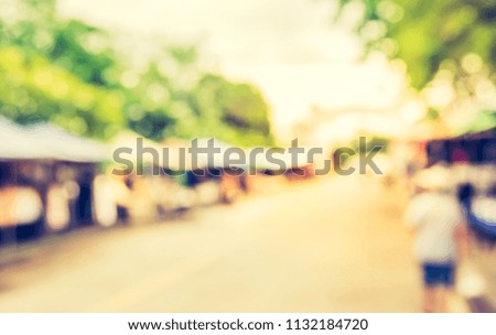 Abstract blur image of  Street Day Market with bokeh for background usage . (vintage tone)