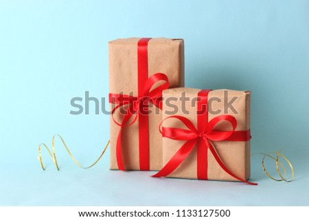 gifts, candy and festive ribbons on a colored background. holiday, giving, new year, christmas, birthday
