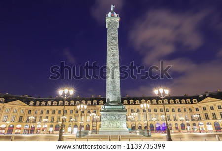 Vendome column with statue of Napoleon Bonaparte, on the Place Vendome at night, in France. Vendome column has 425 spiraling bas-relief bronze plates were made out of cannon.