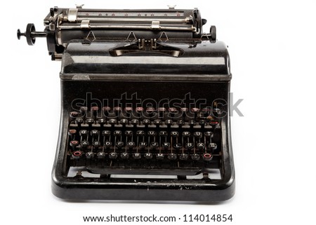 Old antique typewriter on a white background.