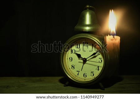 alarm clock with candle light