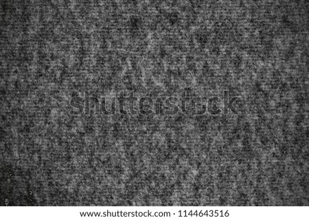 Surface of black - gray color fleece fabric with shade vignette.  Background texture of soft and touch material.