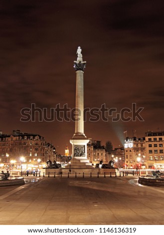 London Trafalgar square with Nelsons column at night
