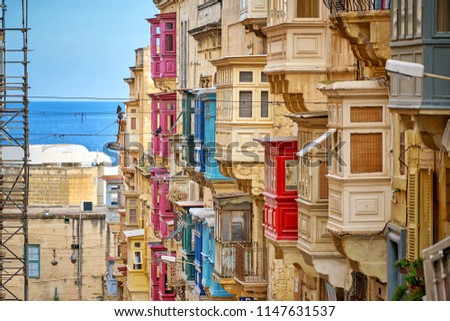 Maltese house with a lot of traditional colored balconies in Valletta city