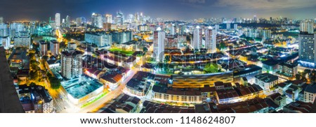 Panorama of downtown Singapore with Business district, Little India and Flyer wheel, at night