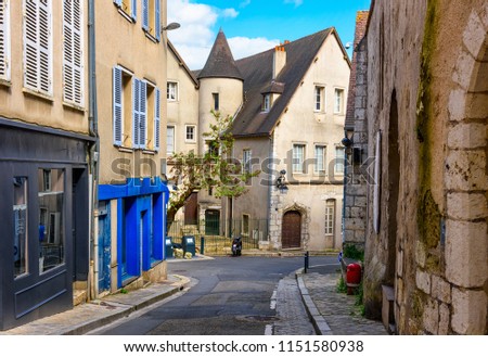 Old street with old houses in a small town Chartres, France