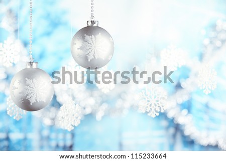 Christmas balls hanging on blue background