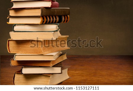 Books collection in pile on background