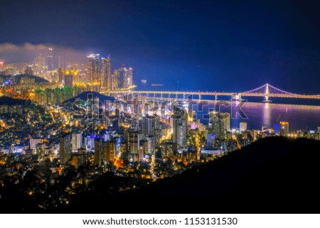 Aerial view of Busan city at night with Gwangan bridge, South Korea.